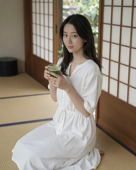 Beautiful Japanese woman enjoying matcha tea in a traditional tearoom